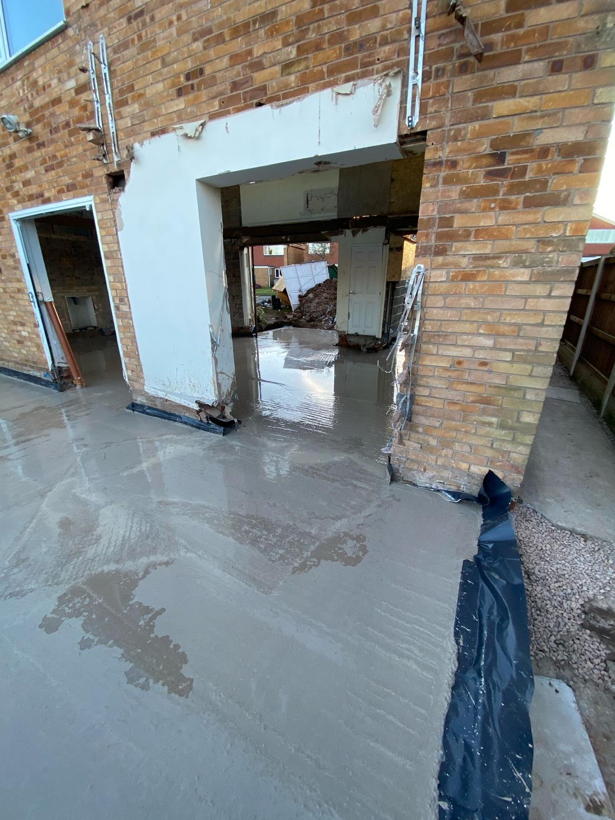 Power-floated concrete slab running through to the garage opening