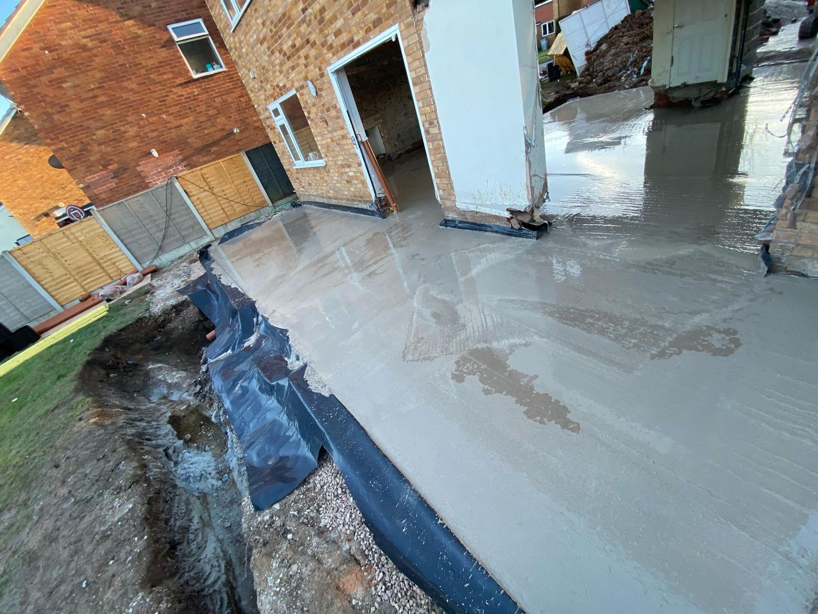 Damp proof membrane laid over the compacted sub-base before the concrete pour