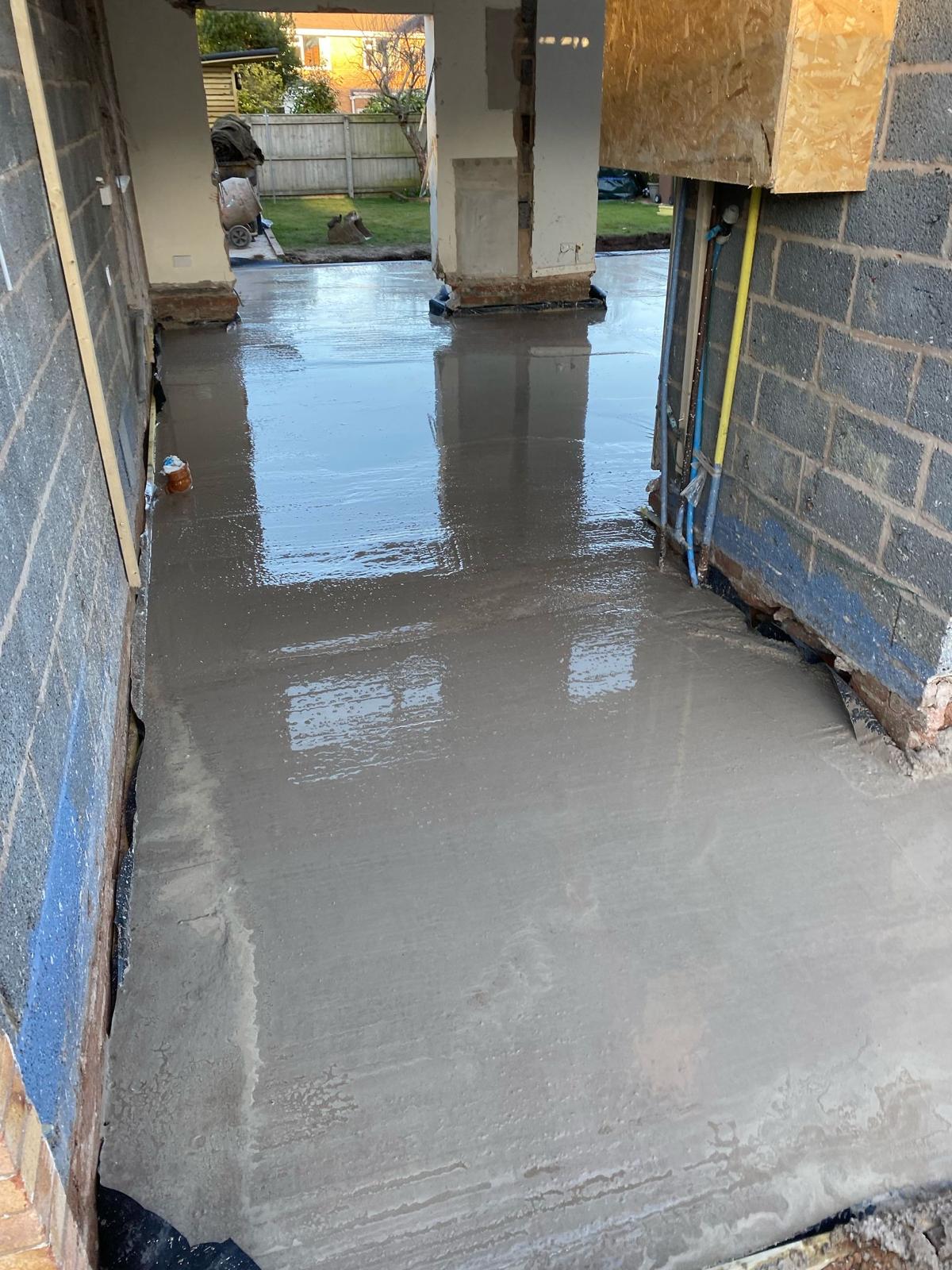 Finished power-floated concrete base ready for a bungalow extension